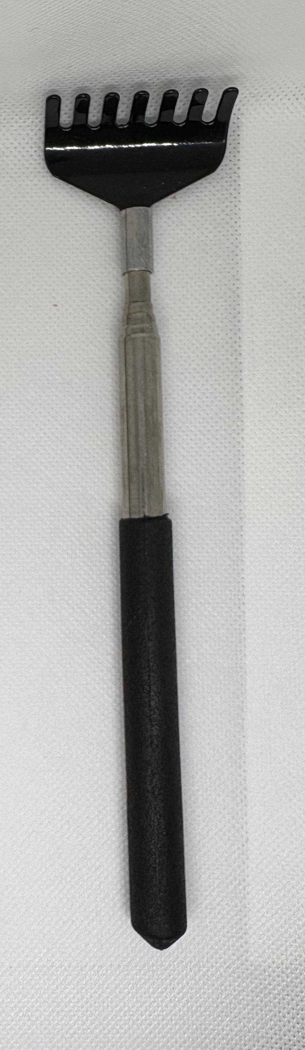 “Scratch my Back” Back Scratcher extends 26 inches